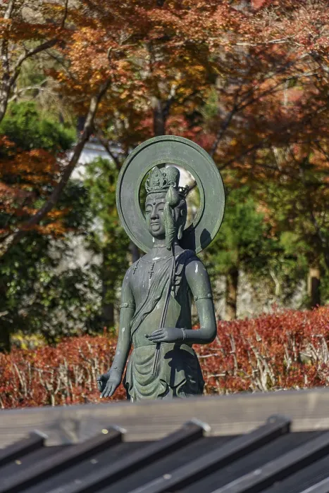 Framed Print : Buddhist statue in front of autumn trees Framed Print : Buddhist statue in front of autumn trees