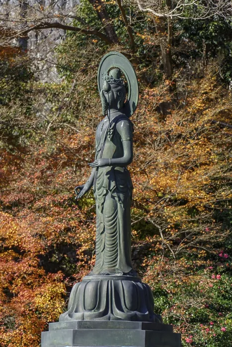 Framed Print : Buddhist statue in front of colorful autumn leaves Framed Print : Buddhist statue in front of colorful autumn leaves