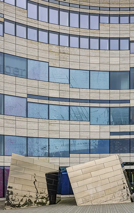 Framed Print : Building with undulating glass facade and artistic elements Framed Print : Building with undulating glass facade and artistic elements