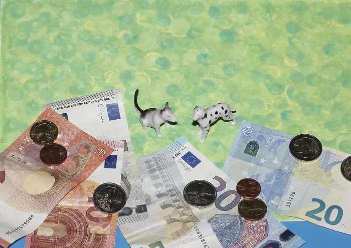 Framed Print : Bull terrier and Dalmatian miniature figure standing on green background with euro coins and notes Framed Print : Bull terrier and Dalmatian miniature figure standing on green background with euro coins and notes
