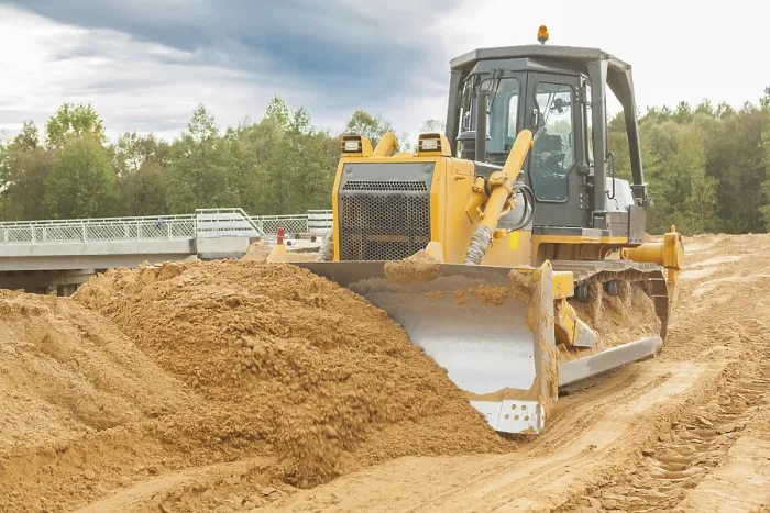 Framed Print : Bulldozer moves sand