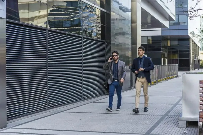 Framed Print : Two business colleagues are walking on the street