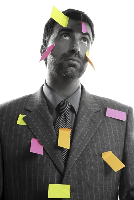 Framed Print : Businessman full of memo stock message notes over white studio background