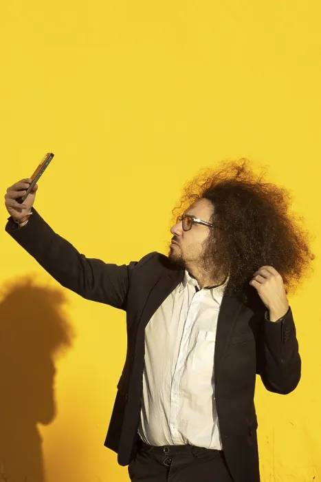 Framed Print : Businessman using a mobile phone taking a selfie