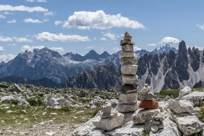 Framed Print : Cairns in front of an impressive Alpine panorama
