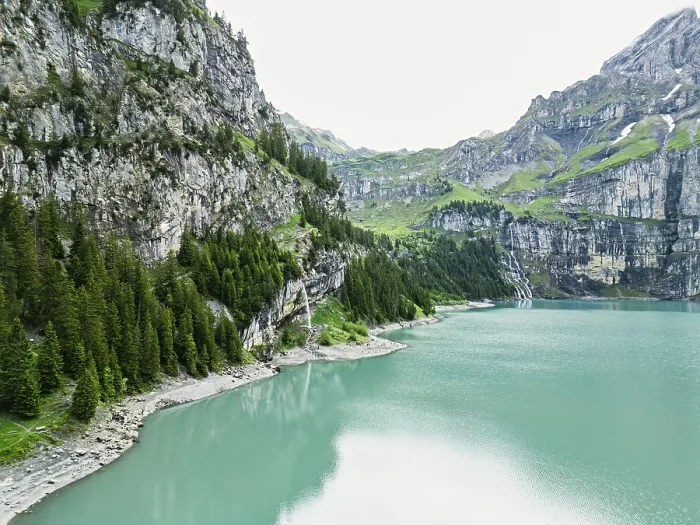 Framed Print : Calm lake encircled by cliffs and greenery with overcast skies Framed Print : Calm lake encircled by cliffs and greenery with overcast skies