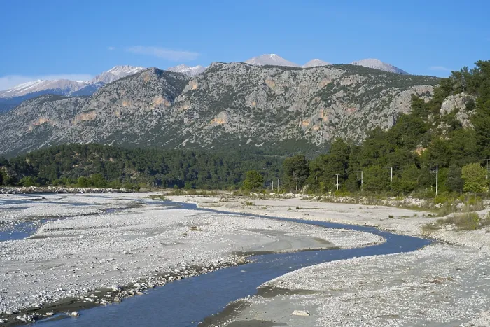 Framed Print : A calm river flows through a wide gravel bed