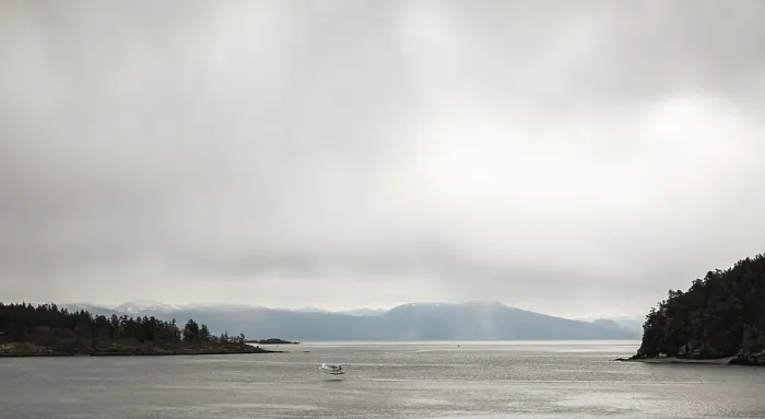 Framed Print : Calm water with distant mountains and a small float plane under an overcast sky in Nanaimo Framed Print : Calm water with distant mountains and a small float plane under an overcast sky in Nanaimo