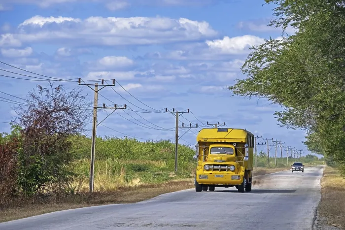 Framed Print : Camione, oldtimer truck converted into public bus driving along the Carretera Central