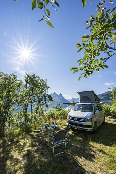 Framed Print : Camper standing by fjord with view of mountains Framed Print : Camper standing by fjord with view of mountains