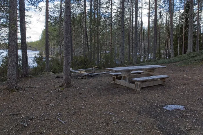 Framed Print : Camping area near lake shore in cloudy spring weather