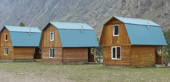 Framed Print : Camping wooden cabins near mountain Framed Print : Camping wooden cabins near mountain