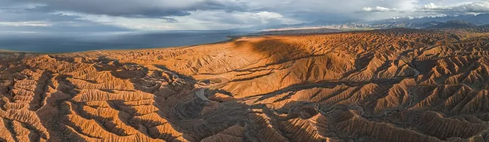 Framed Print : Canyon runs through landscape, Issyk Kul Lake