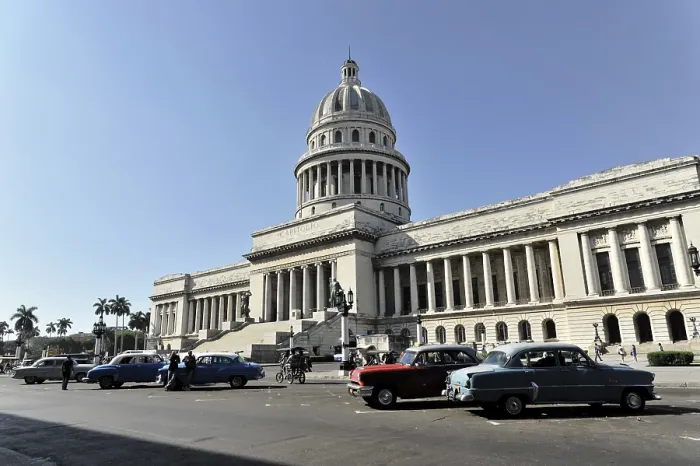 Framed Print : The Capitol surrounded by vintage and modern cars on the street on a sunny day