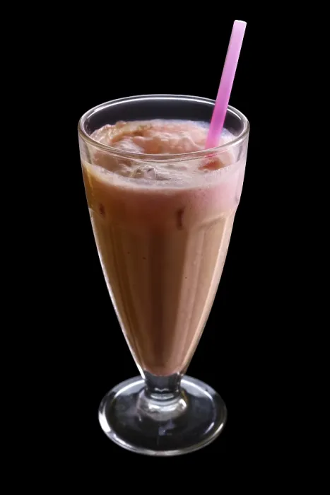 Framed Print : Cappuccino milkshake isolated on black background