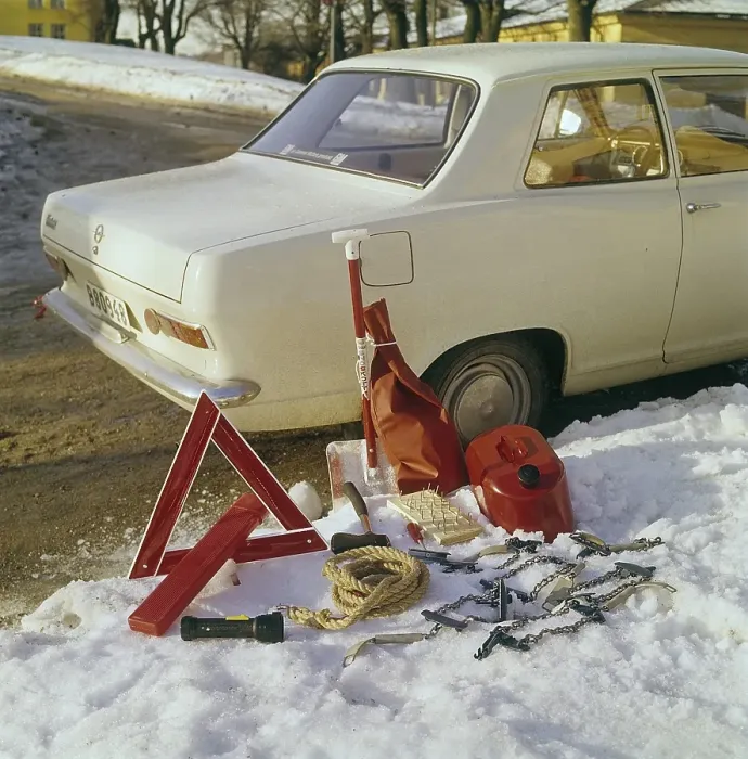 Framed Print : Car accessories in the 1960s. A white Opel serves as the background for this image showing the sensible accessories for winter driving