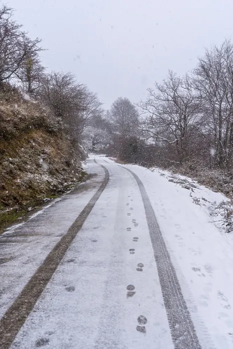 Framed Print : Car tracks on the road to mount aizkorri in gipuzkoa