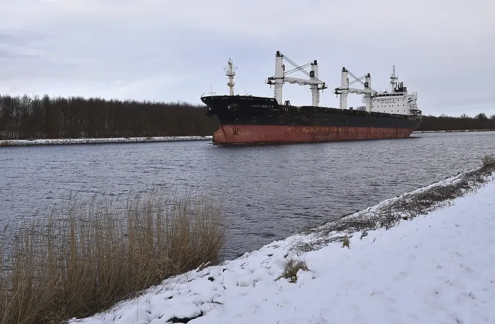 Framed Print : Cargo ship Lilly Bolten sailing in the Kiel Canal in winter