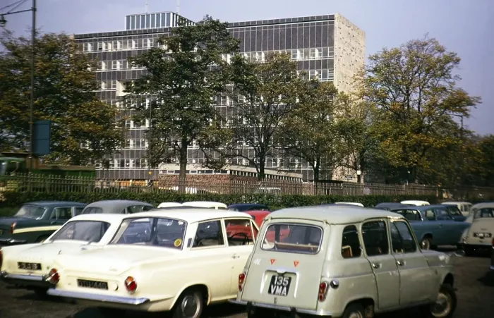Framed Print : Cars in a car park next to a large modern office building, Great Britain 1966, location unknown