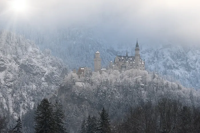 Framed Print : Castle enthroned on a snow-covered hill