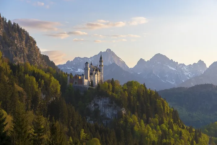 Framed Print : Castle rises majestically in front of an alpine panorama in the evening Framed Print : Castle rises majestically in front of an alpine panorama in the evening
