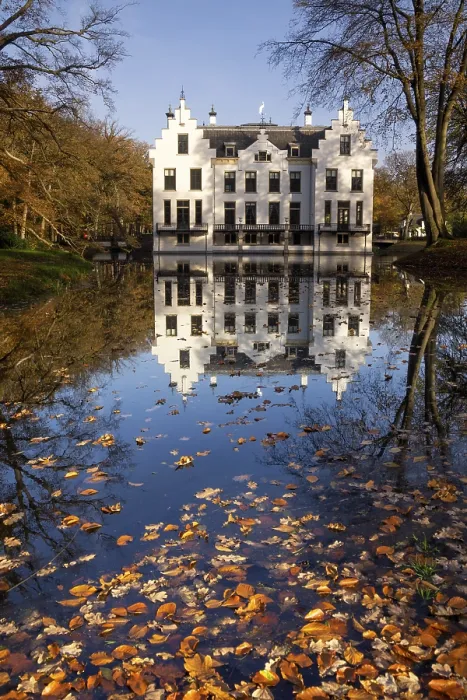 Framed Print : Castle Staverden on the Dutch nature area Veluwe reflecting in the moat and surrounded by autumn colored trees