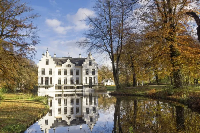 Framed Print : Castle Staverden reflecting in the moat and surrounded by autumn colored trees