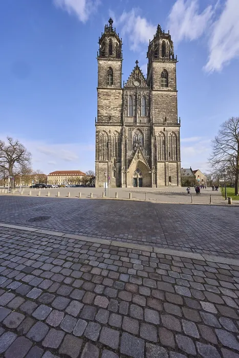Framed Print : Cathedral, cobblestone square, blue sky