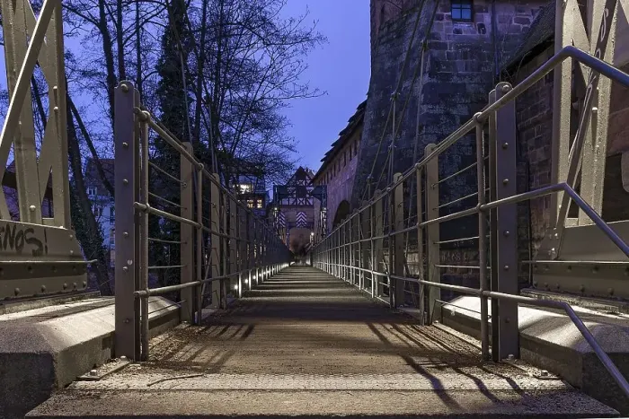 Framed Print : Chain footbridge in evening illumination Framed Print : Chain footbridge in evening illumination
