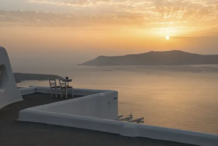 Framed Print : Two chairs on terrace, sunset, view of ocean
