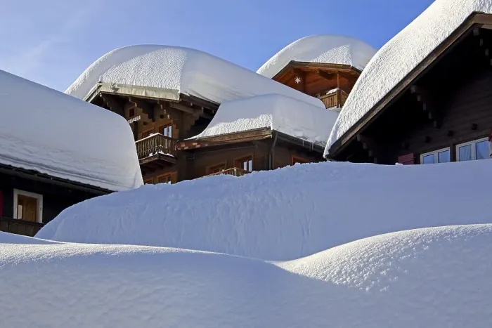 Framed Print : Chalets with deep snow in the village