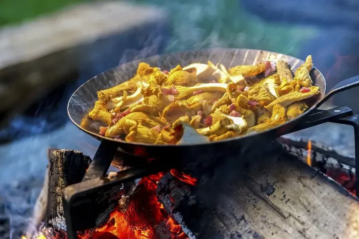 Framed Print : Chanterelles in a pan over an open fire