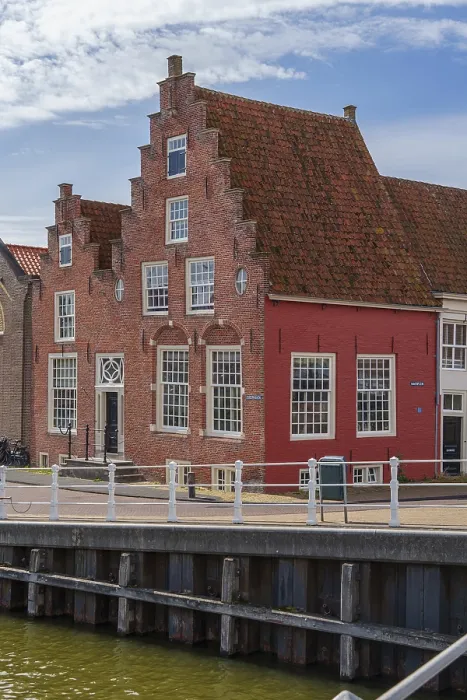 Framed Print : Charming red half-timbered house on the waterfront with historic architecture Framed Print : Charming red half-timbered house on the waterfront with historic architecture