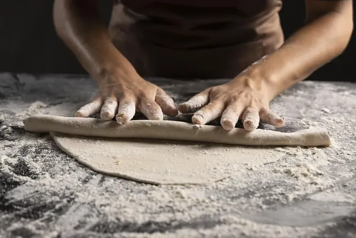 Framed Print : Chef rolling dough with lot flour table Framed Print : Chef rolling dough with lot flour table