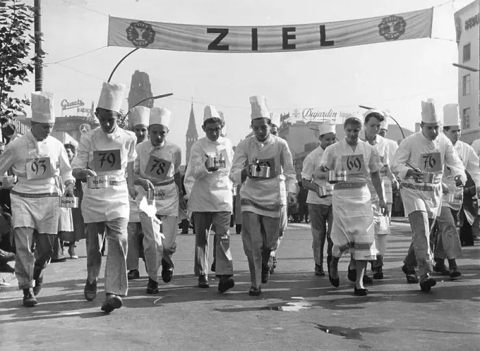 Framed Print : Chefs at the race with cooking pots in hand