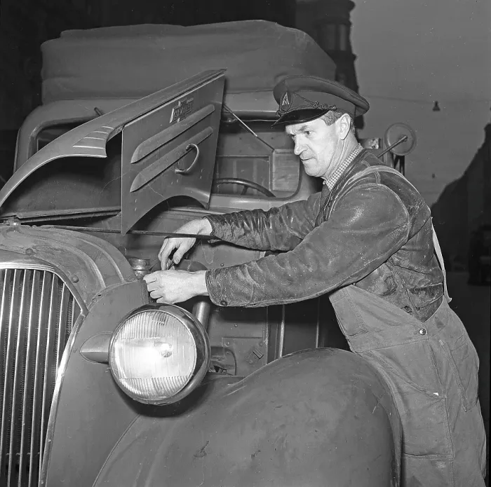 Framed Print : Chevrolet truck 1942. A truck driver at the company Arvid Nordquist in Stockholm is servicing the company's Chevrolet truck. 1942. The man has the hood open and is fixing or adjusting something in the engine Framed Print : Chevrolet truck 1942. A truck driver at the company Arvid Nordquist in Stockholm is servicing the company's Chevrolet truck. 1942. The man has the hood open and is fixing or adjusting something in the engine