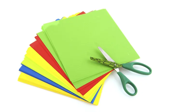 Framed Print : Child scissors with colorful paper isolated over white background