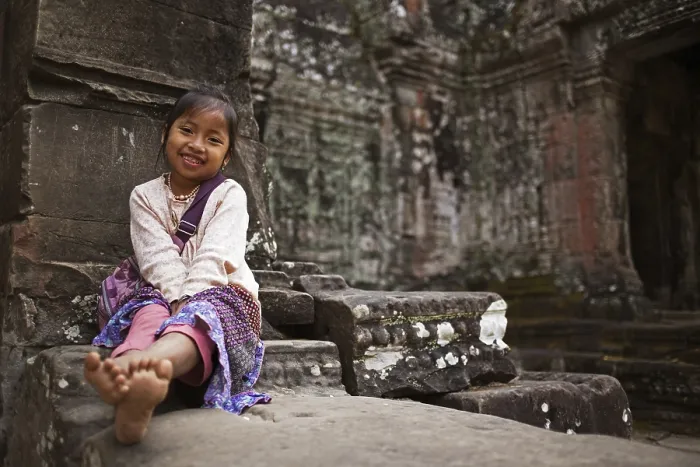 Framed Print : Child sitting in front of preah khan temple Framed Print : Child sitting in front of preah khan temple