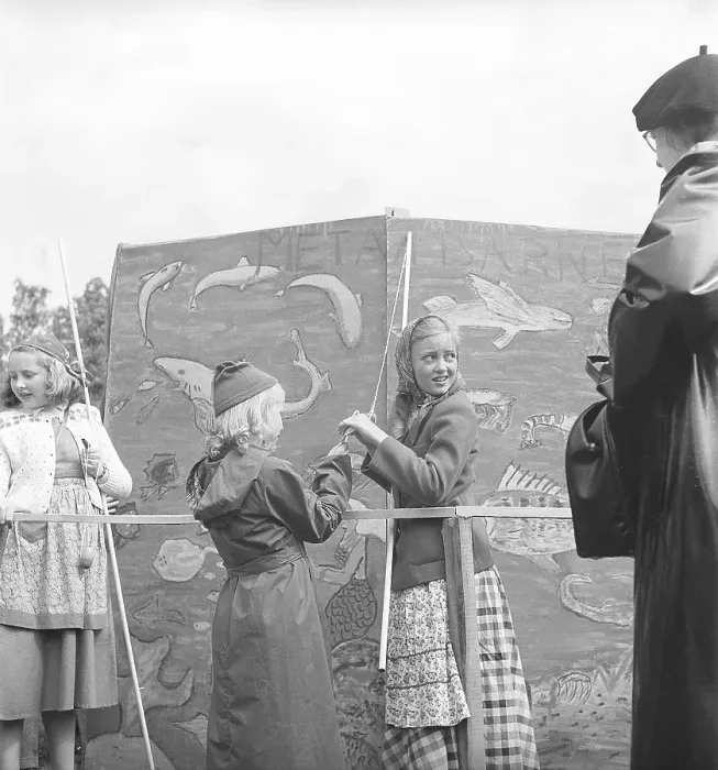 Framed Print : Children in the 1940s. Two girls are catching something in the classic game of fish pond. A string with a clothespin instead of a fishing hook is attached to a stick that is supposed to represent a fishing rod Framed Print : Children in the 1940s. Two girls are catching something in the classic game of fish pond. A string with a clothespin instead of a fishing hook is attached to a stick that is supposed to represent a fishing rod