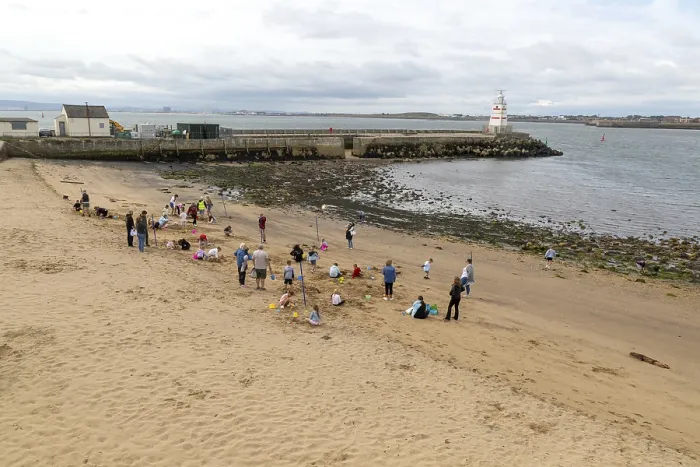 Framed Print : Children enjoying summer holiday activities on sandy beach