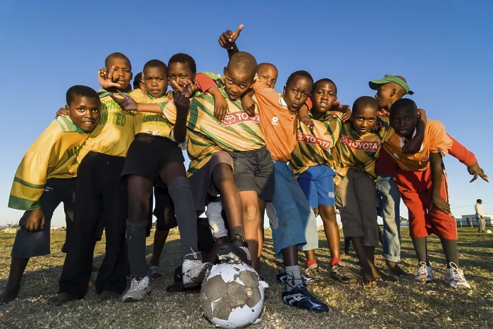 Framed Print : Children with a football, football team