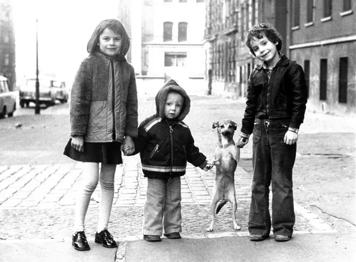 Framed Print : Children with small dog, ca. 1980s Framed Print : Children with small dog, ca. 1980s