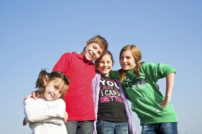 Framed Print : Four children standing arm in arm Framed Print : Four children standing arm in arm