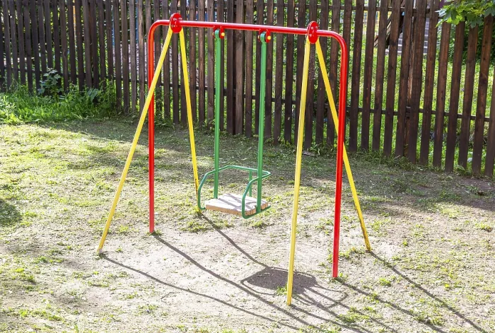 Framed Print : Children's metal swing for play and rest in summer Framed Print : Children's metal swing for play and rest in summer