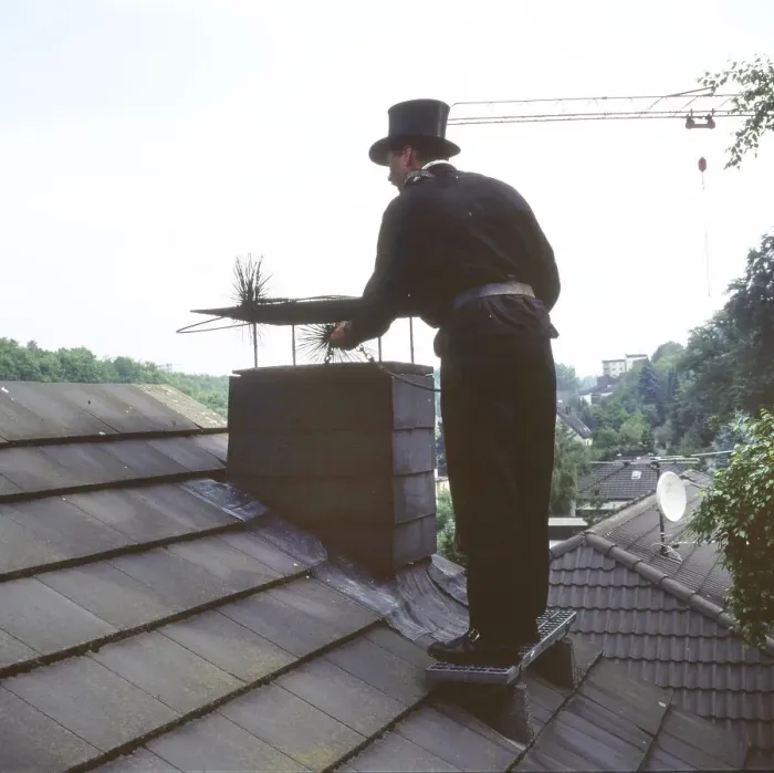 Framed Print : Chimney sweep in professional training and posing in a photo studio Framed Print : Chimney sweep in professional training and posing in a photo studio