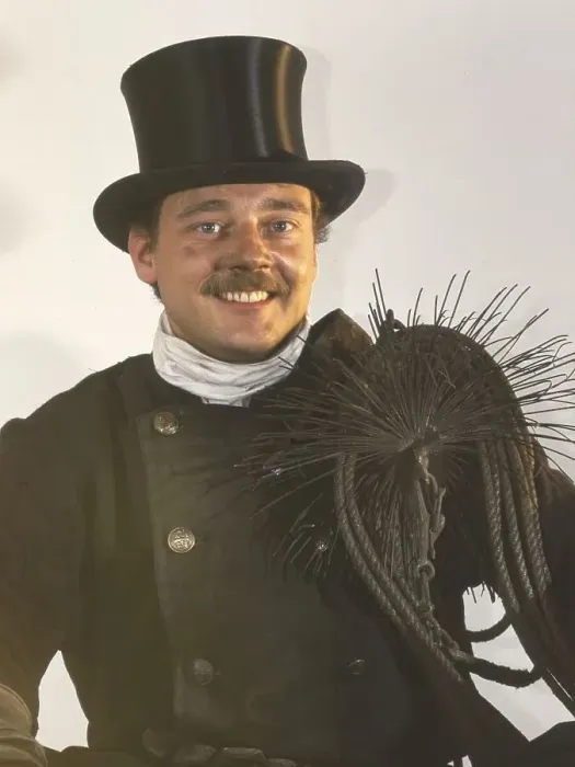 Framed Print : Chimney sweep in professional training and posing in a photo studio Framed Print : Chimney sweep in professional training and posing in a photo studio