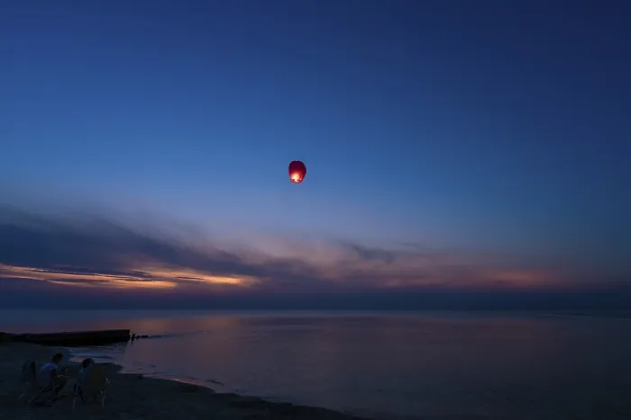 Framed Print : Chinese lantern flying over the calm sea at night Framed Print : Chinese lantern flying over the calm sea at night