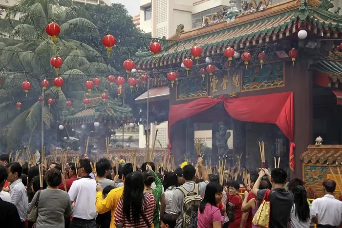 Framed Print : Chinese New Year ceremony with incense sticks in front of the buddhist Kwam Im Tong Hood Che temple in Singapore