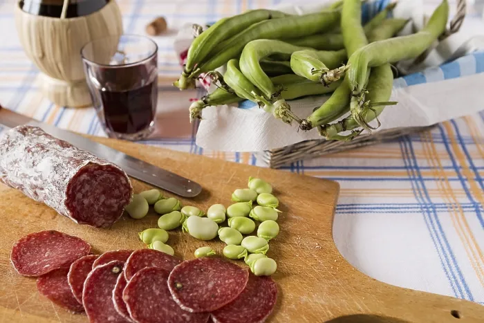 Framed Print : Chopping board with salami broad bean and a glass of red wine Framed Print : Chopping board with salami broad bean and a glass of red wine