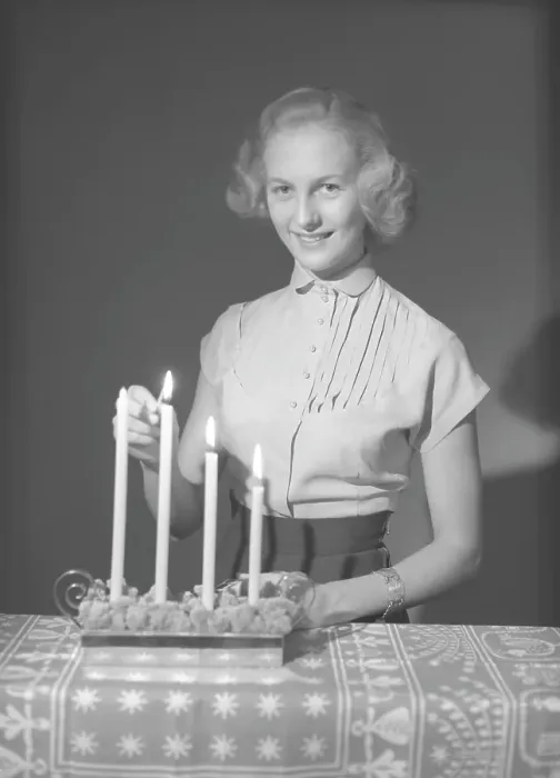 Framed Print : Christmas in the 1950s. Margit Sjoedin is lighting the candles at christmas Framed Print : Christmas in the 1950s. Margit Sjoedin is lighting the candles at christmas